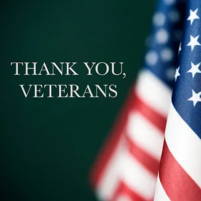 An American flag beside the words Thank You, Veterans
