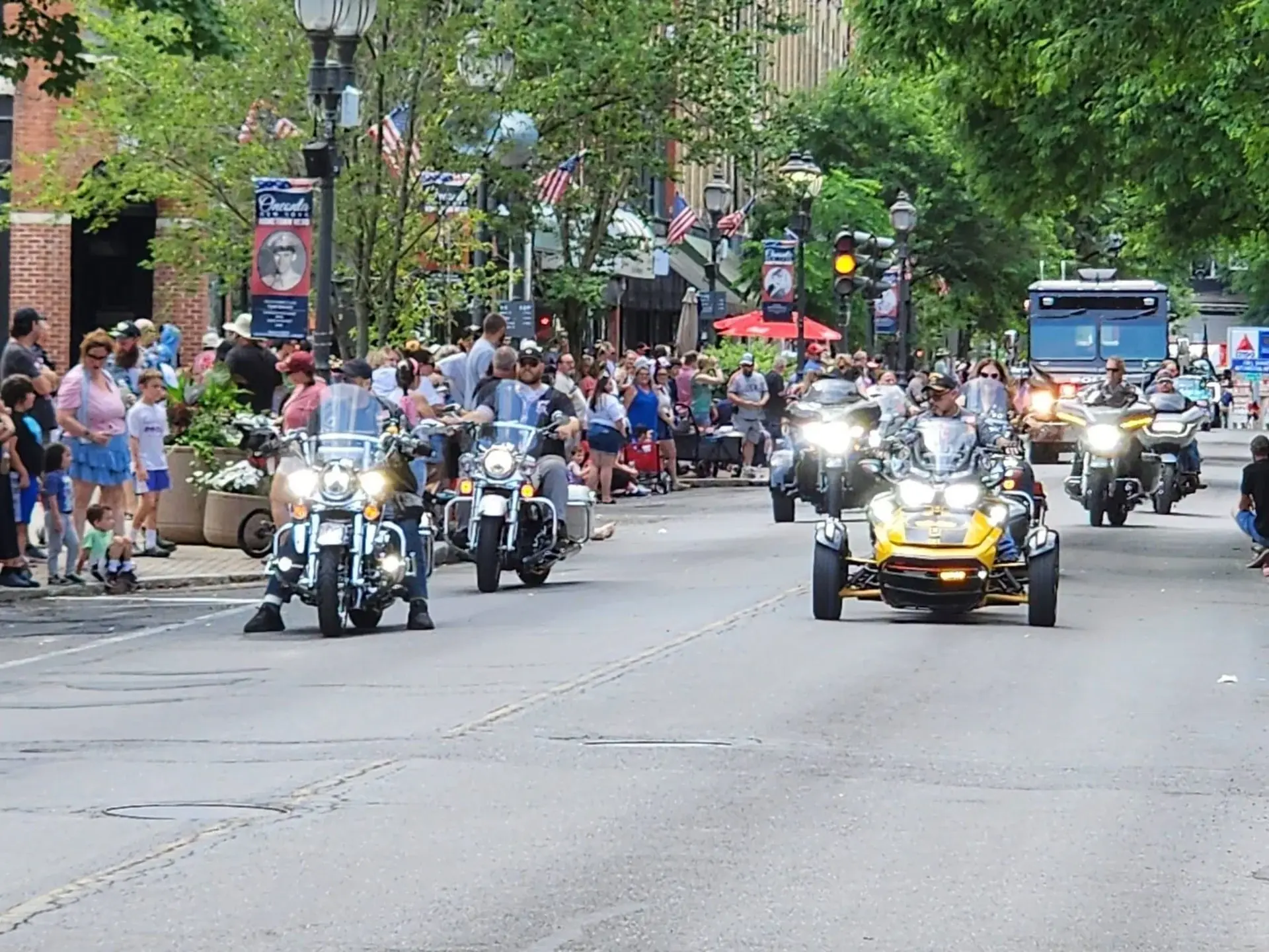 ALR Post 259 members riding motorcycles through downtown Oneonta during a parade
