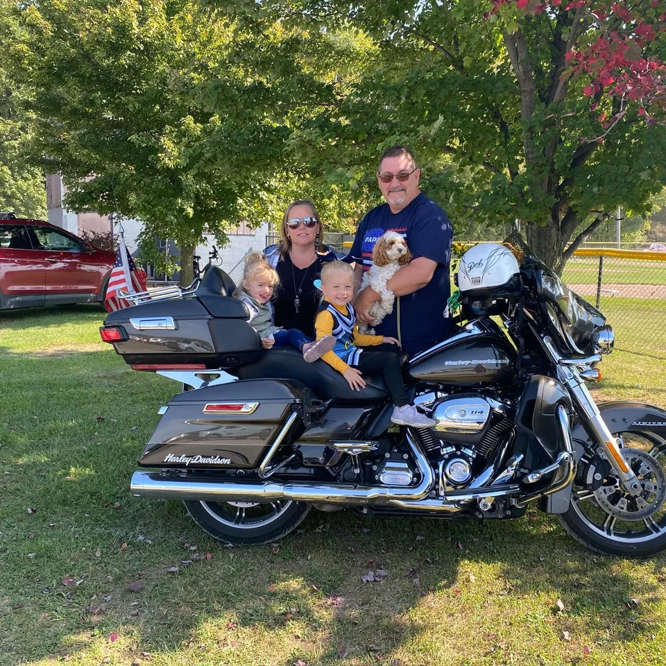 Deb and Chris Dennis with Bailey and two children on their Harley-Davidson
