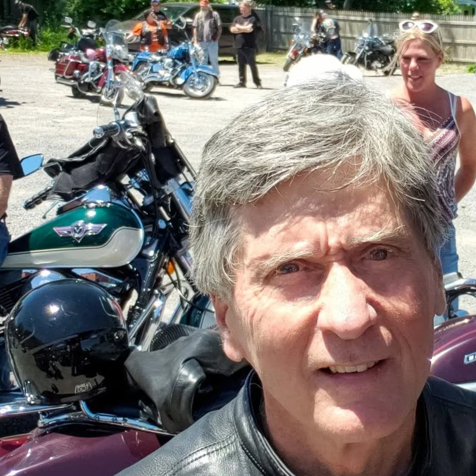 David Buck wearing his leather vest at a motorcycle gathering