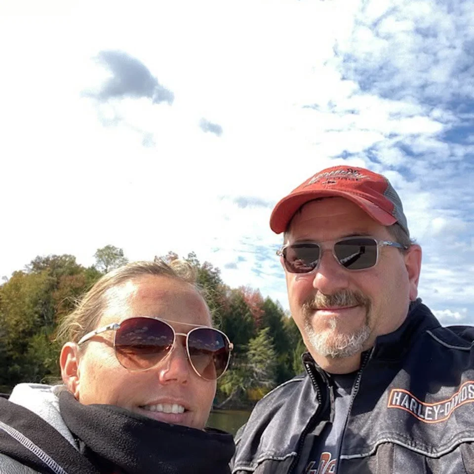 Deb and Chris Dennis taking a selfie in their riding gear