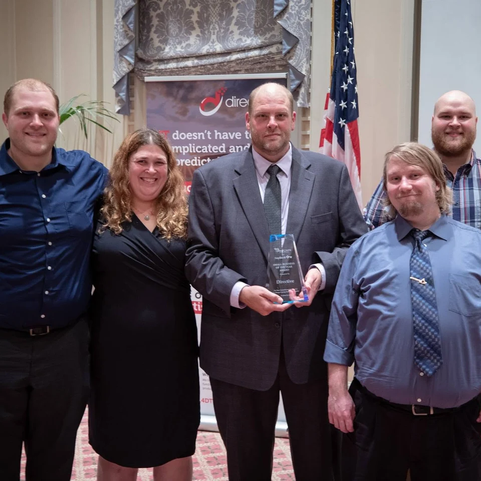 Dillon Chase with coworkers at an award ceremony