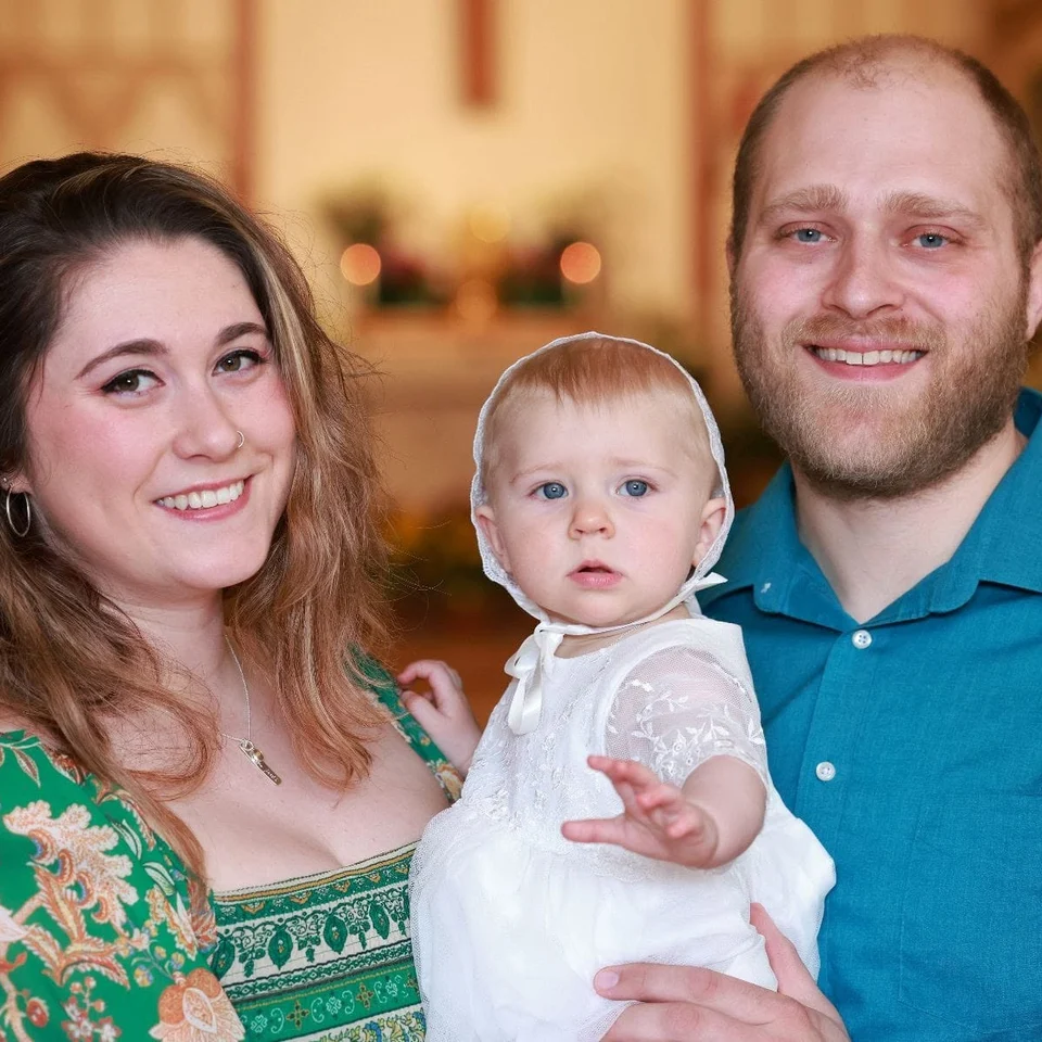 Rebecca Chase with her husband and young child at a family gathering